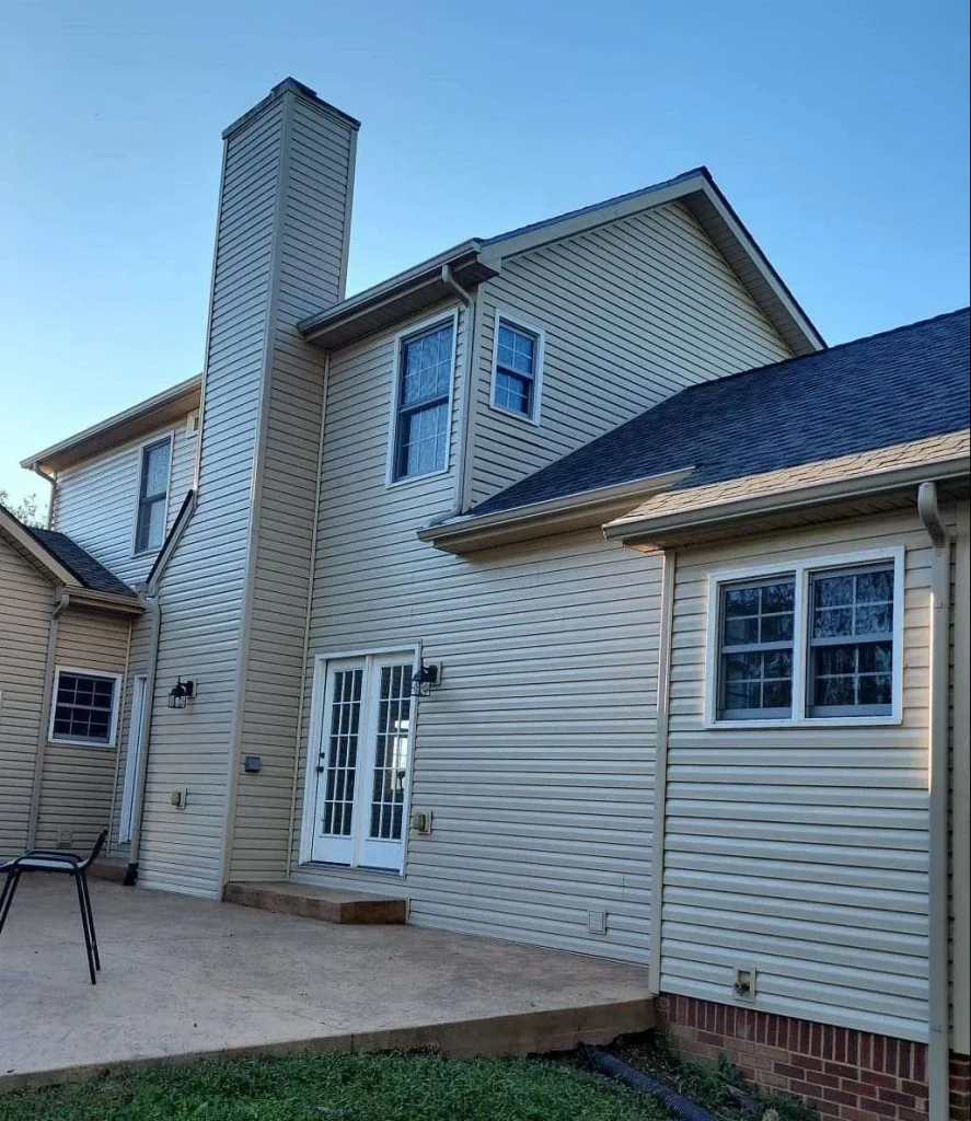 Home exterior showcasing freshly installed beige siding, emphasizing clean and modern aesthetics.