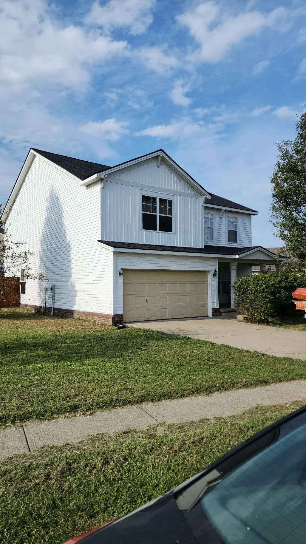 New siding installation on a two-story home in Lexington, KY, showcasing AIC Roofing & Construction’s professional siding services.