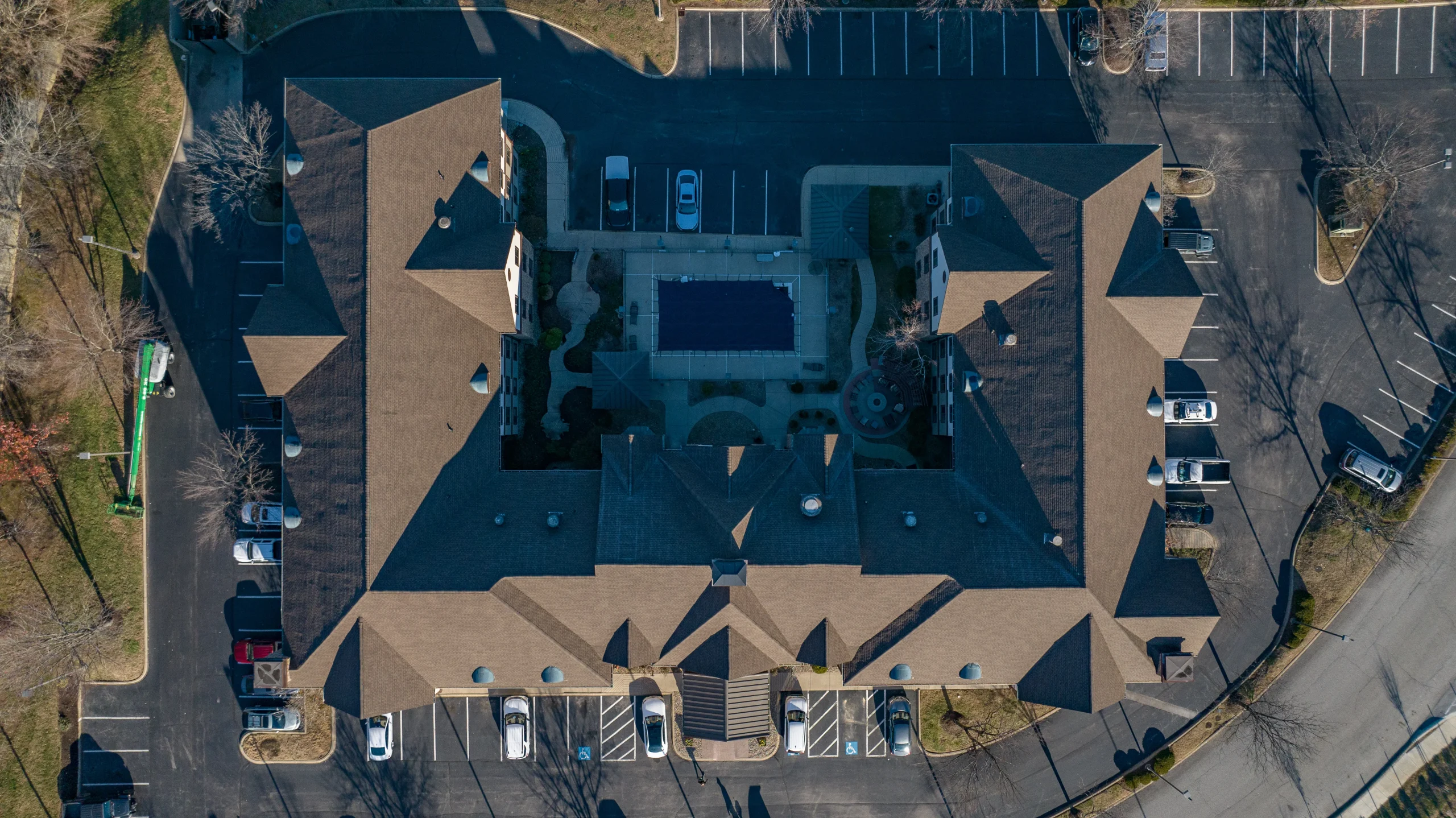 Aerial view of a multifamily roof replacement project in Louisville, KY, showcasing a durable shingle roofing system installed by AIC Roofing & Construction.