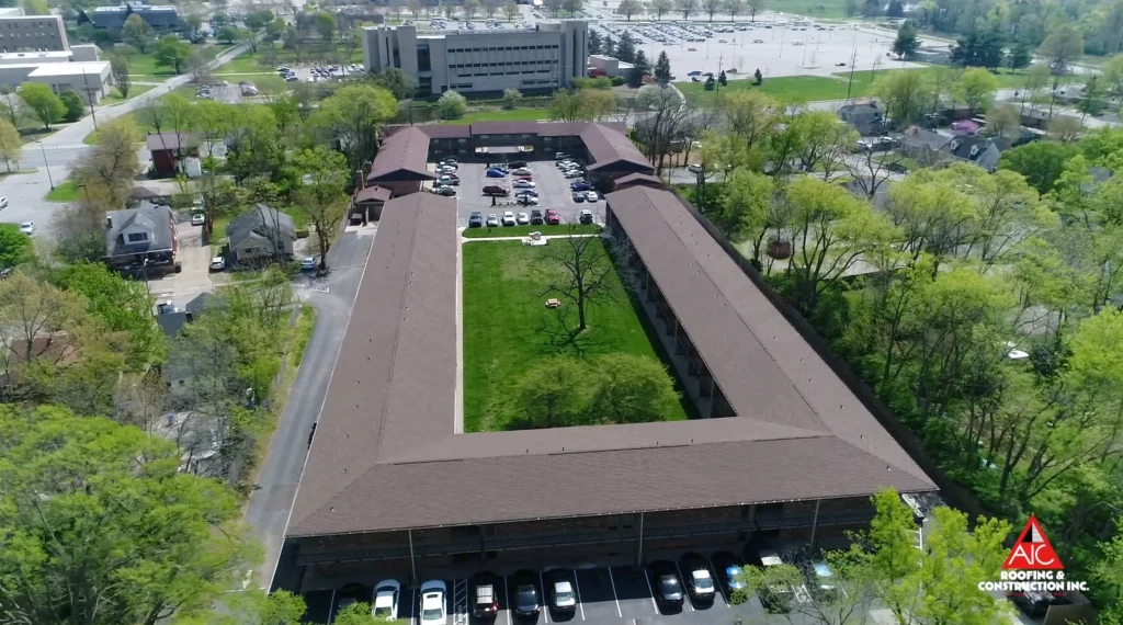 A large apartment complex in Lexington, Kentucky, featuring a newly installed Hickory-colored GAF shingle roof, completed as part of a multifamily roof replacement project.