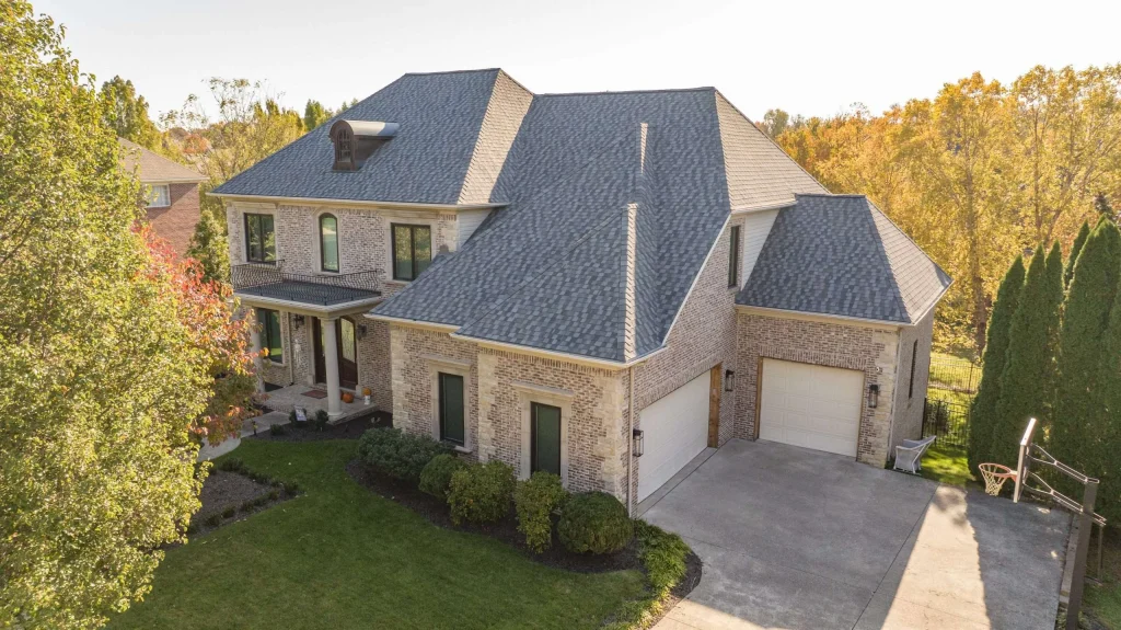 Elegant home in Lexington with a new roof featuring Timberline HDZ shingles in Nantucket Morning color