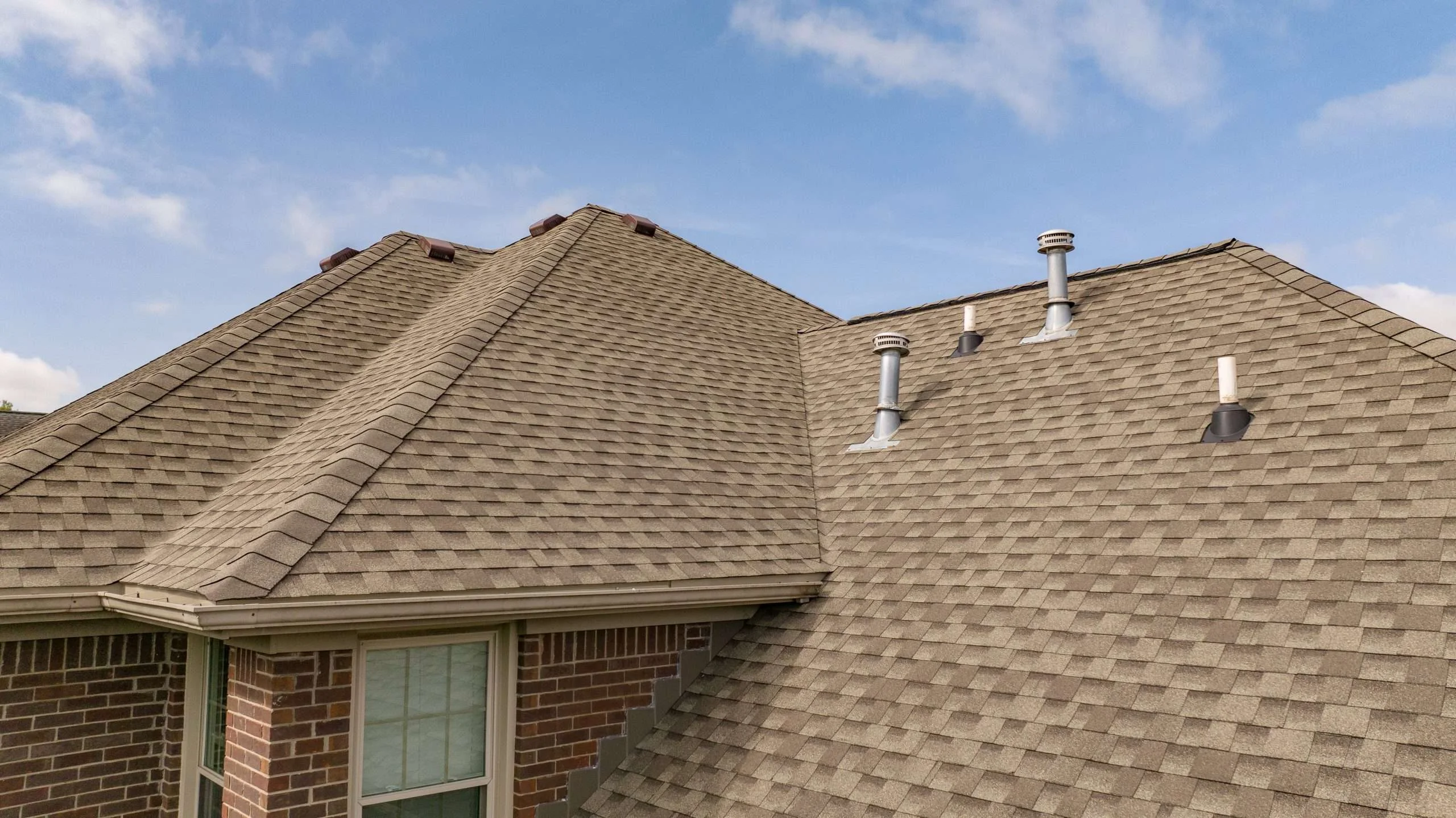 se-up of a roof replacement in Lexington, Kentucky with GAF Weathered Wood shingles installed by a roofing contractor