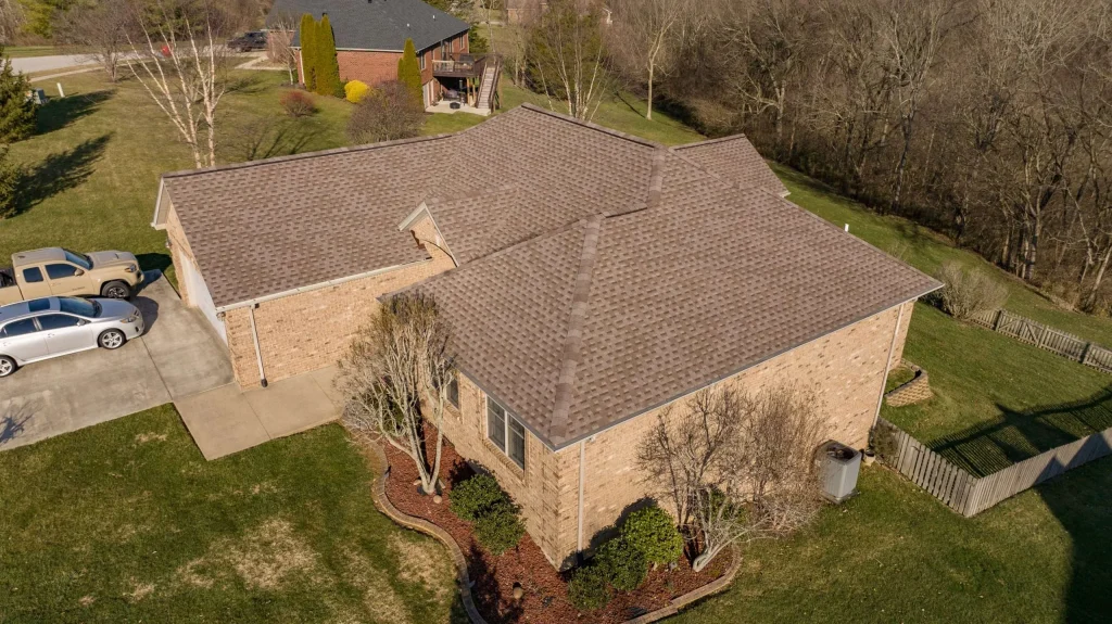 Enhance your home with a new roof – take advantage of our special offers. A Richmond home with a newly installed Mission Brown roof, showcasing expert roof replacement work.