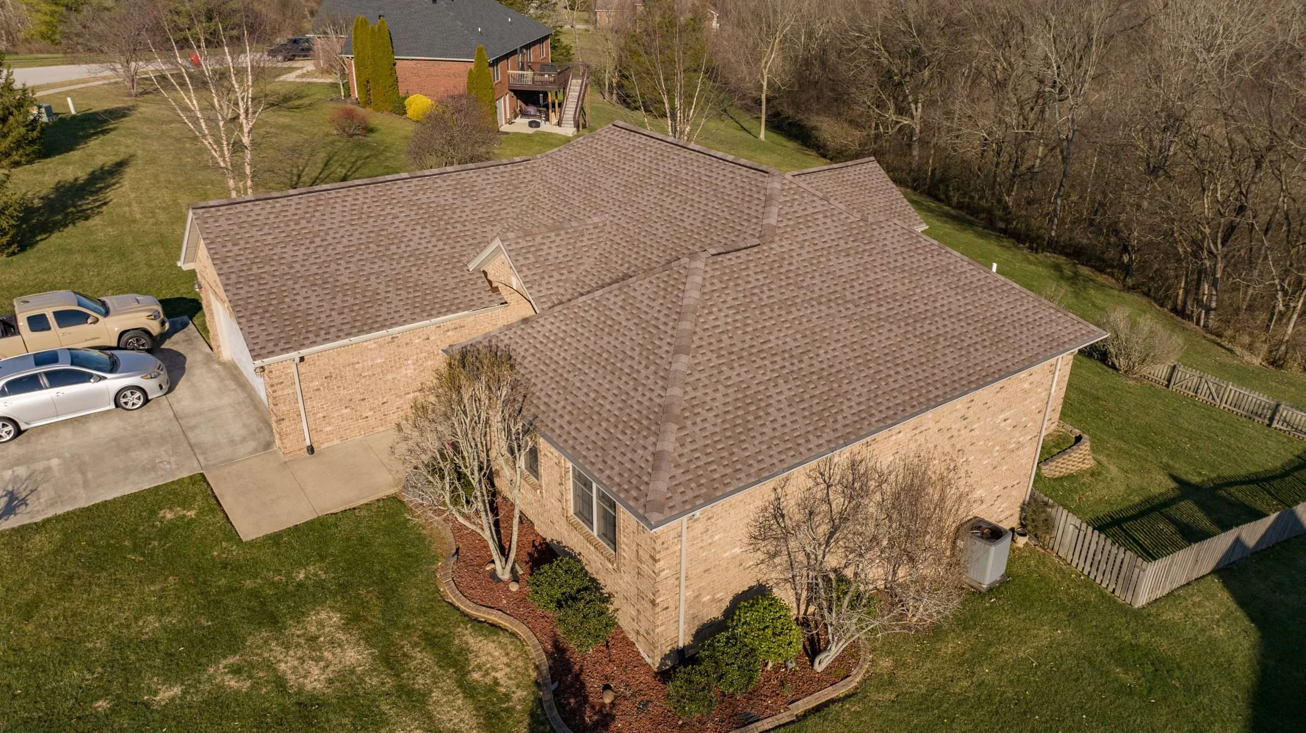 A Richmond home with a newly installed Mission Brown roof, showcasing expert roof replacement work.