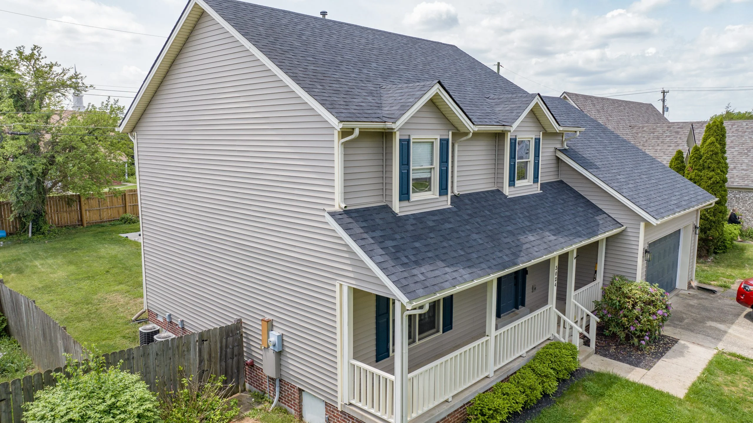 Newly installed siding on a residential home in Lexington, KY, completed by AIC Roofing & Construction, providing high-quality siding and roofing services.