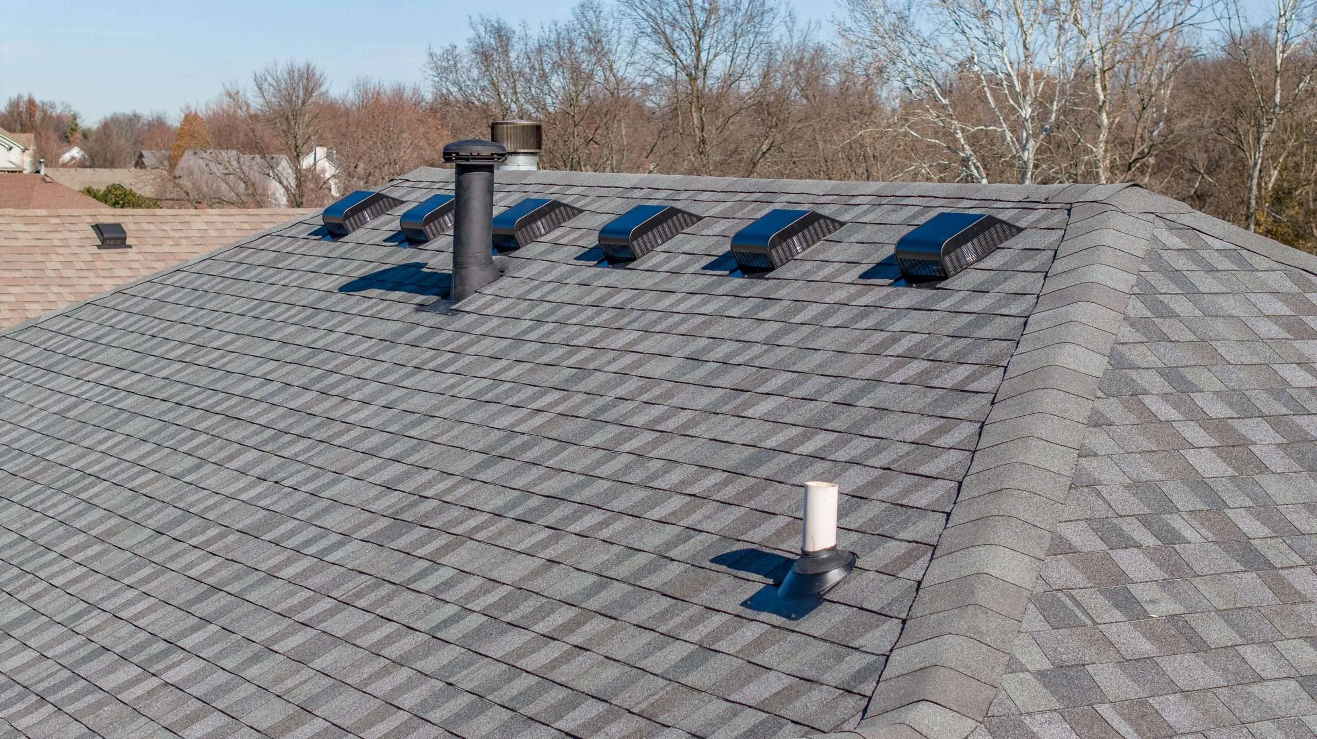 Close-up view of a roof featuring GAF Timberline shingles in Nantucket Morning, installed with expert craftsmanship by a Louisville roofing contractor.