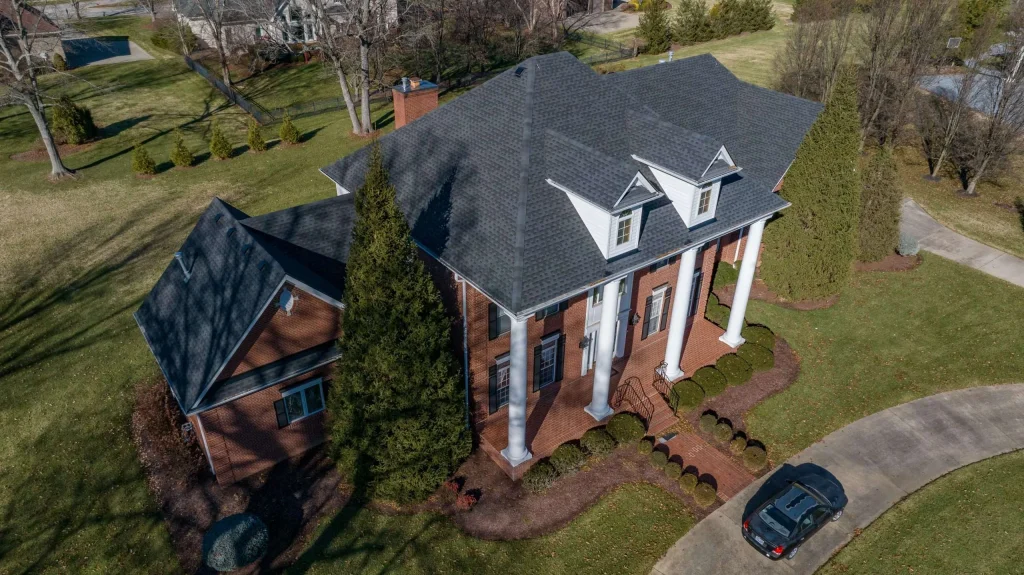 Aerial view of roof replacement in Prospect KY with GAF Timberline HDZ Charcoal shingles, completed by AIC Roofing & Construction.