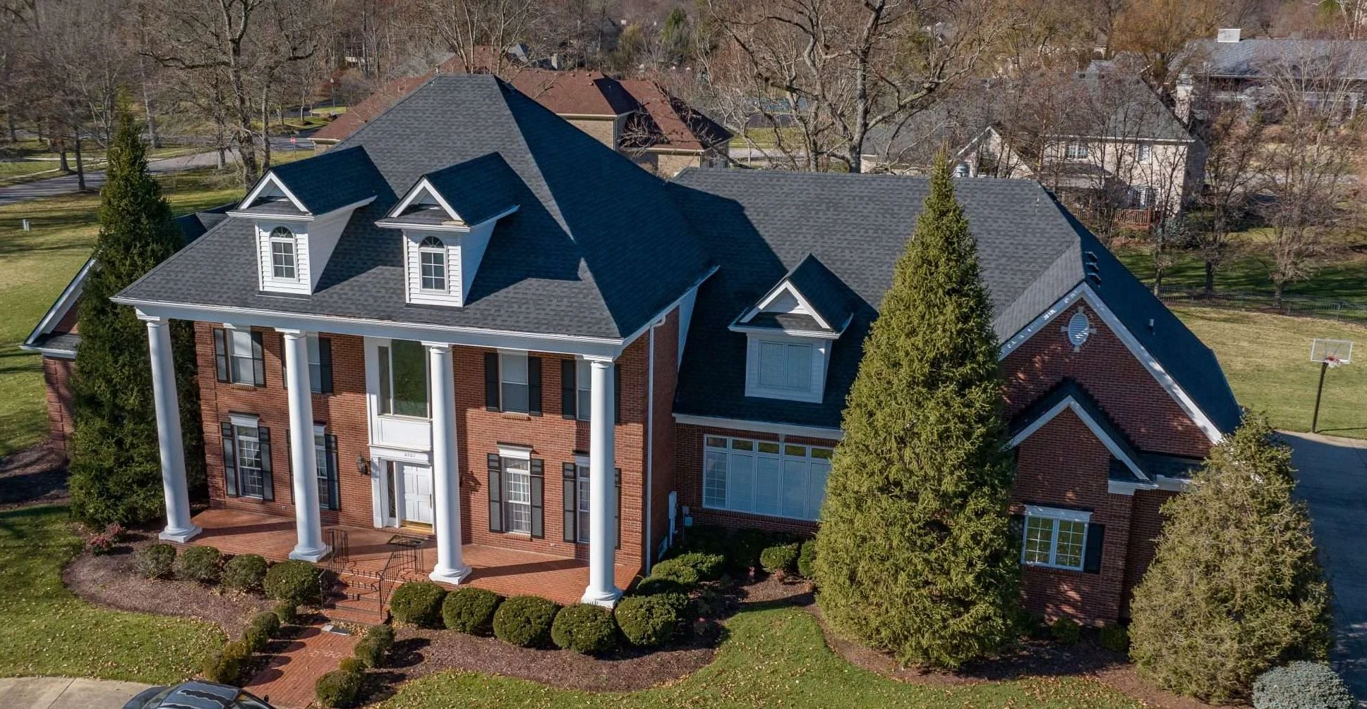 Elegant Prospect KY home with a recent roof replacement in Charcoal by AIC Roofing & Construction.