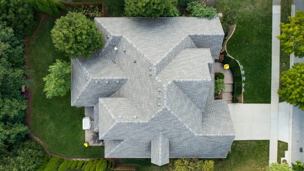 Overhead view of a professionally installed residential roof in Louisville, KY, showcasing AIC Roofing & Construction’s commitment to quality roof replacement.