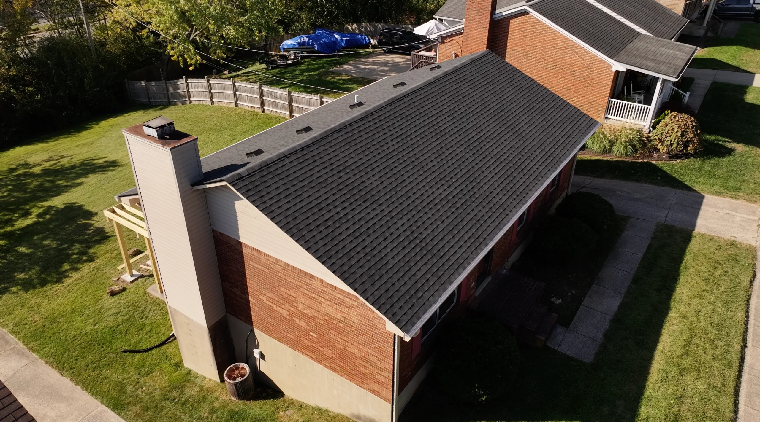 Side view of a home with a newly installed GAF Timberline HDZ shingle roof by a local roofing contractor.