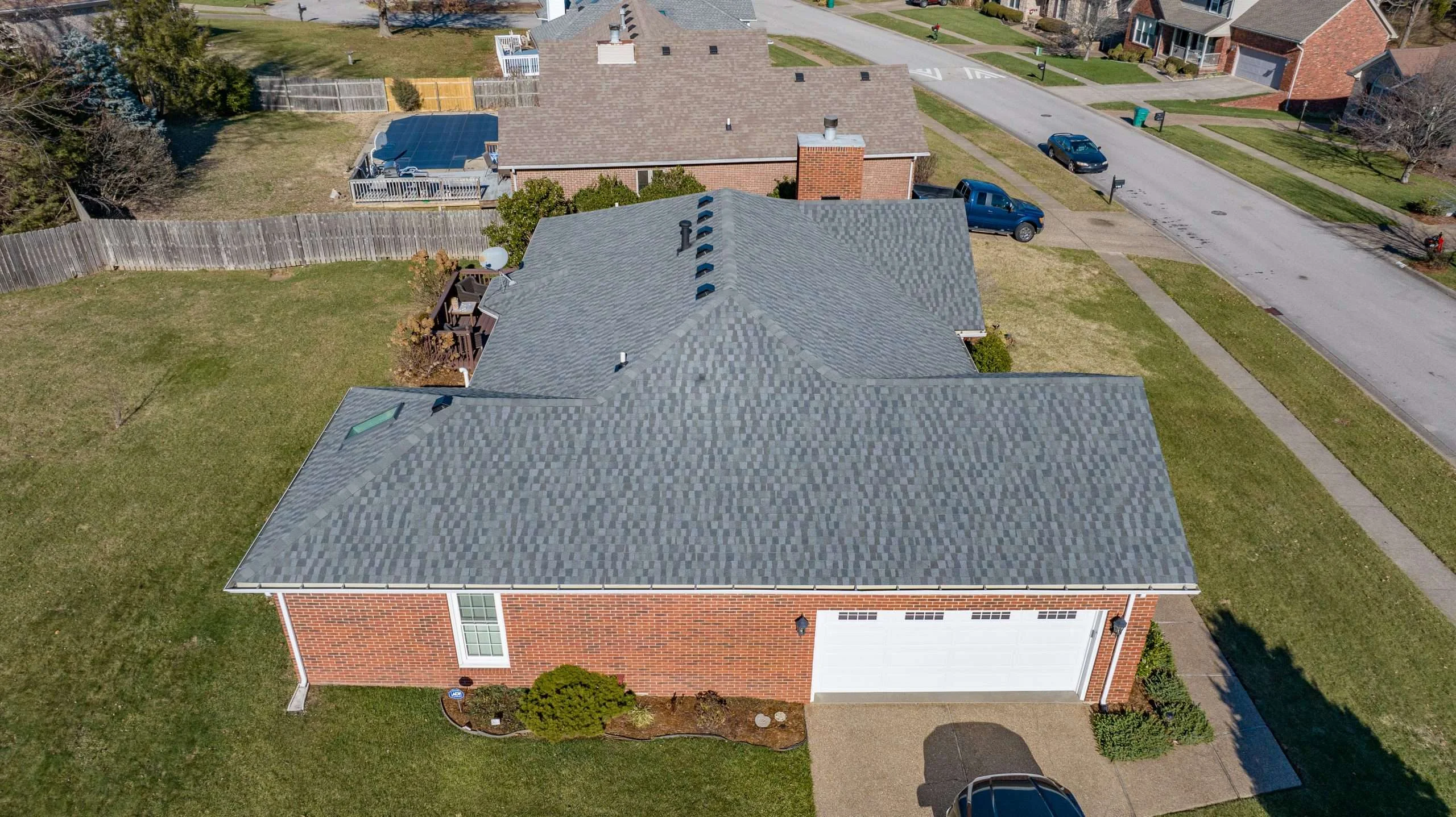 Aerial view of a newly installed roof featuring GAF Timberline shingles in Nantucket Morning, completed by a trusted Louisville roofing contractor.