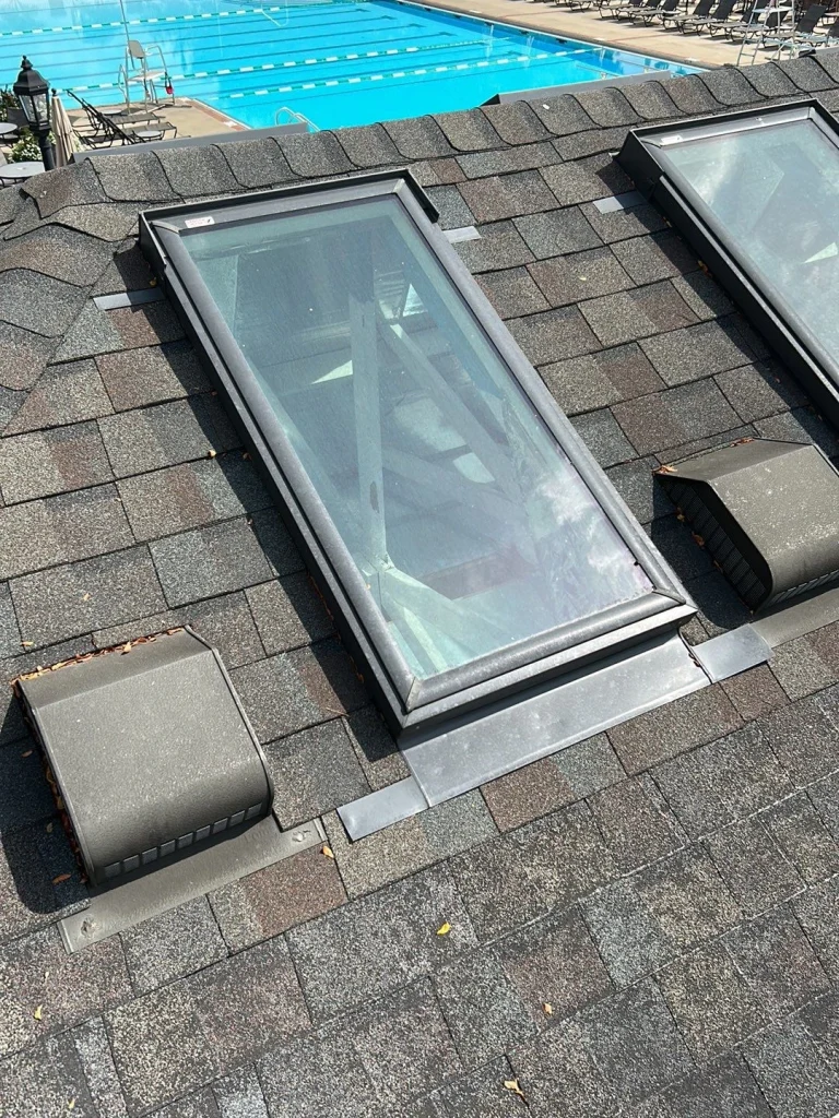 Close-up of skylight installation on a residential roof in Lexington, KY, highlighting AIC Roofing & Construction’s expertise in roofing and siding services.