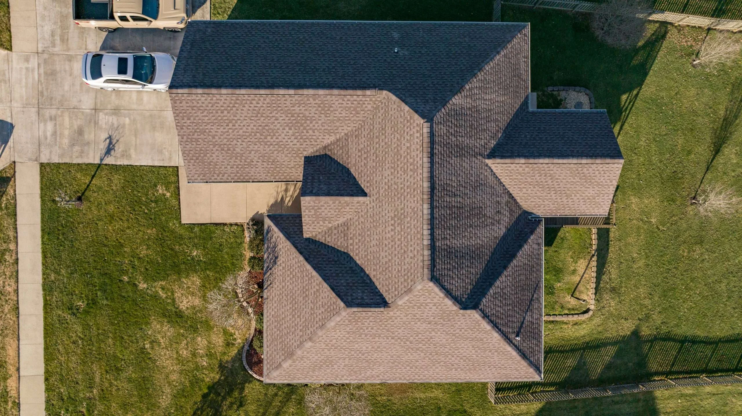 Aerial view of a Richmond home's Mission Brown roof replacement, showcasing the craftsmanship of a trusted Richmond roofing contractor.