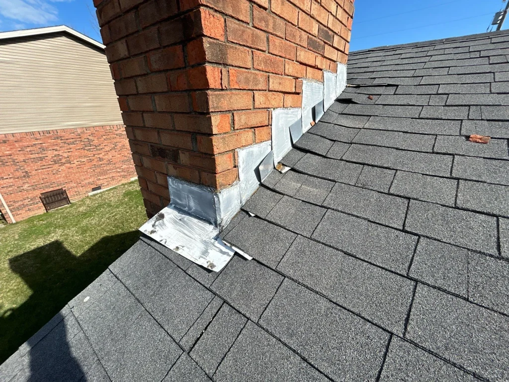 Loose chimney flashing on brick chimney during roof repair in Richmond KY