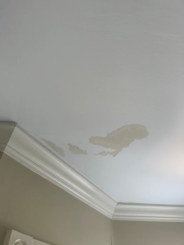 Interior ceiling water damage caused by a commercial roof leak