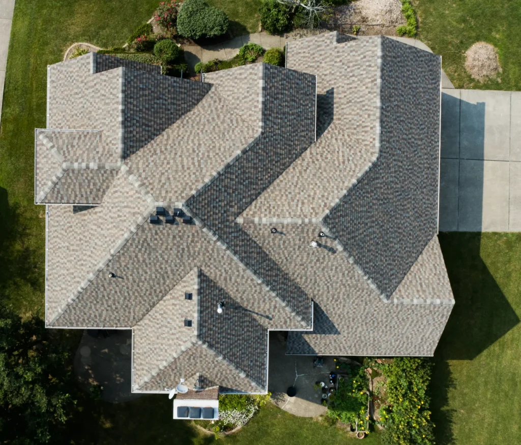 Upgrade your home with discounted premium roofing services. Top-down drone view of a completed roof replacement on a large Richmond, KY home.
