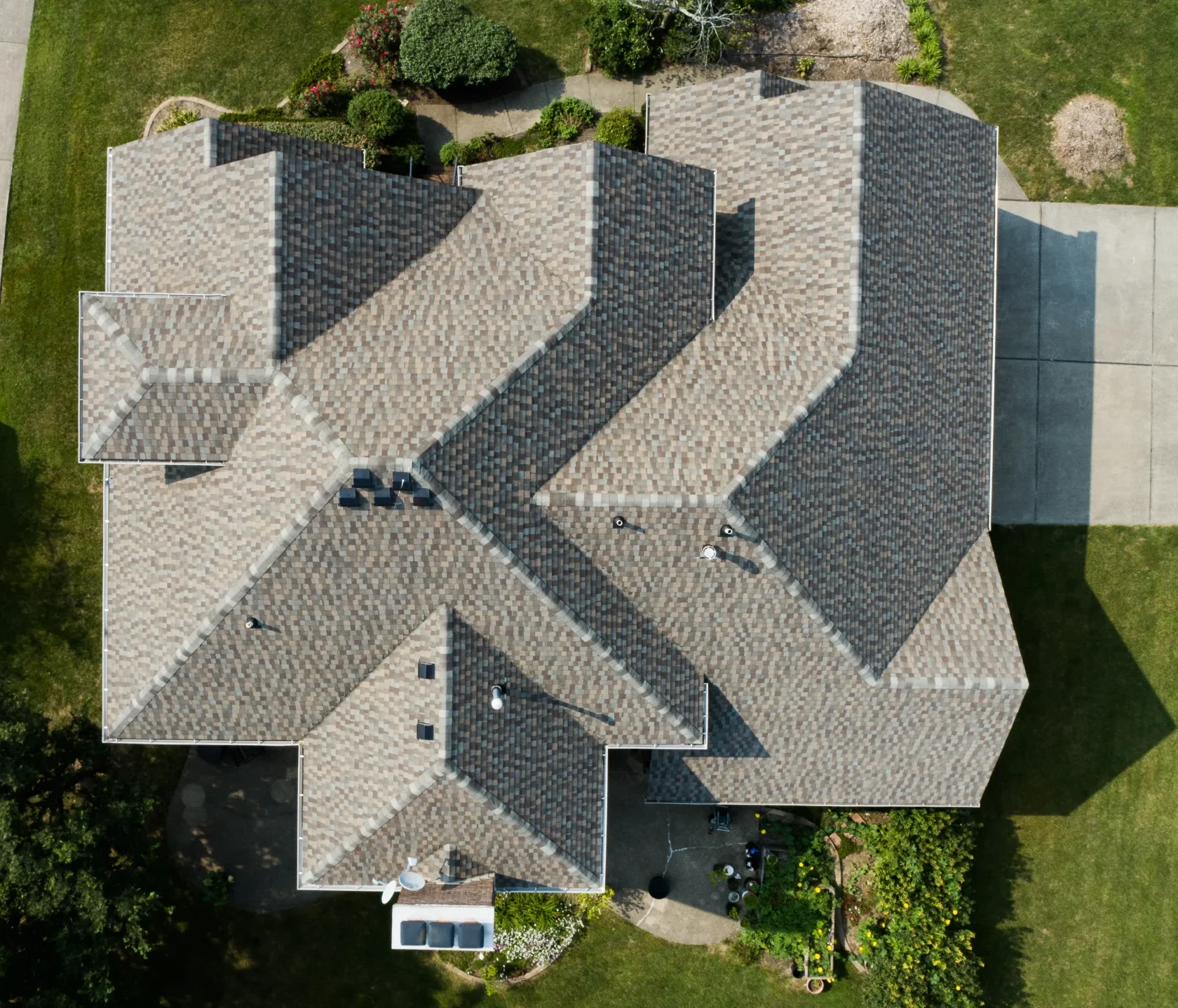 Top-down drone view of a completed roof replacement on a large Richmond, KY home.