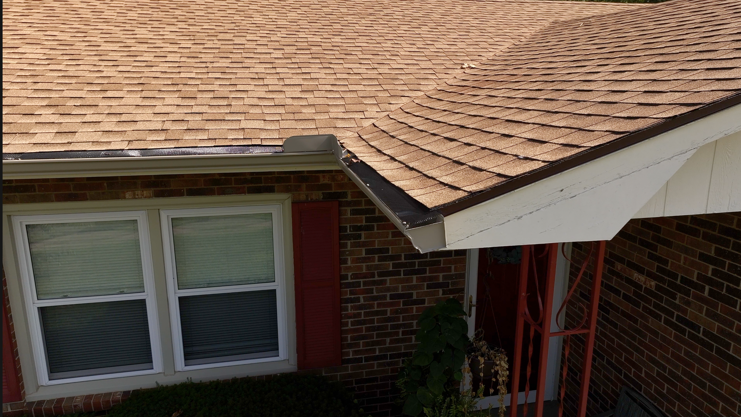 Newly installed seamless gutters on a brick home in Louisville, KY.