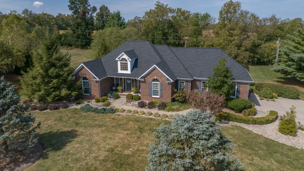 A beautiful Richmond, KY home with new roofing, siding, and gutters surrounded by well-maintained landscaping.