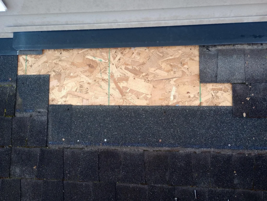 Unfinished roof repair showing exposed decking before shingle installation in Louisville KY.