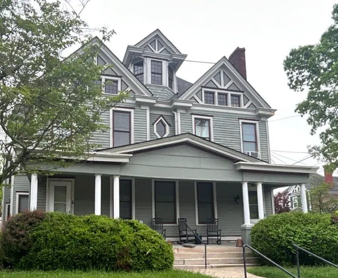 A Victorian-style Lexington home with a brand-new roof installed by AIC Roofing & Construction.
