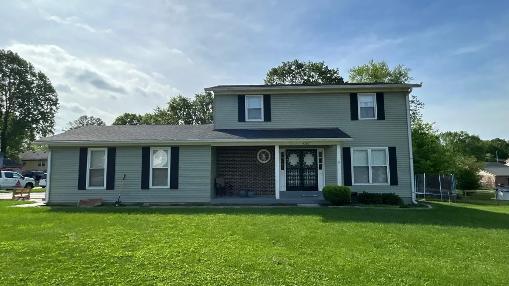 Two-story home in Jeffersonville, IN with a new roof installed by AIC Roofing & Construction.