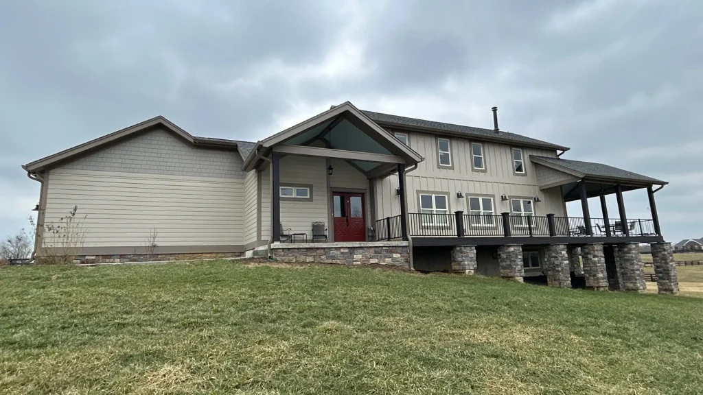Modern farmhouse-style home with new roof replacement by AIC Roofing & Construction