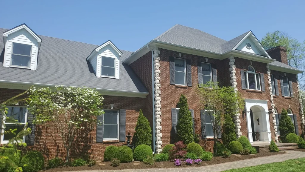 New roof installation on a two-story brick home in Nicholasville, KY by AIC Roofing & Construction