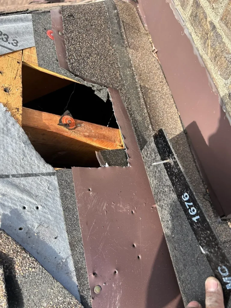 Close-up of exposed roof decking and flashing during a roof repair on a Lexington, KY home by AIC Roofing.