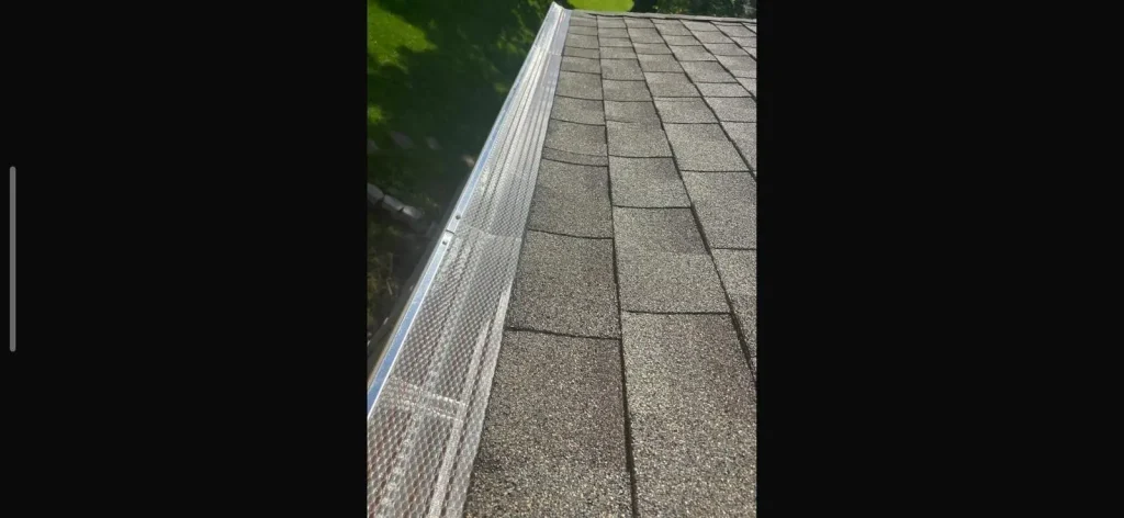 Close-up of newly installed gutter guards on a Richmond home by AIC Roofing & Construction.