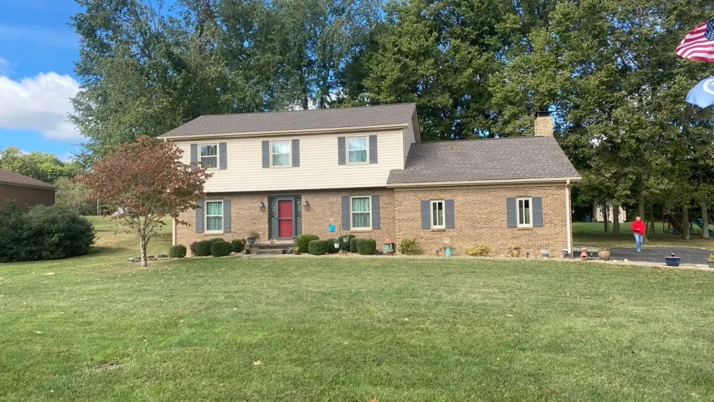 Richmond home with a new roof replacement by AIC Roofing & Construction.