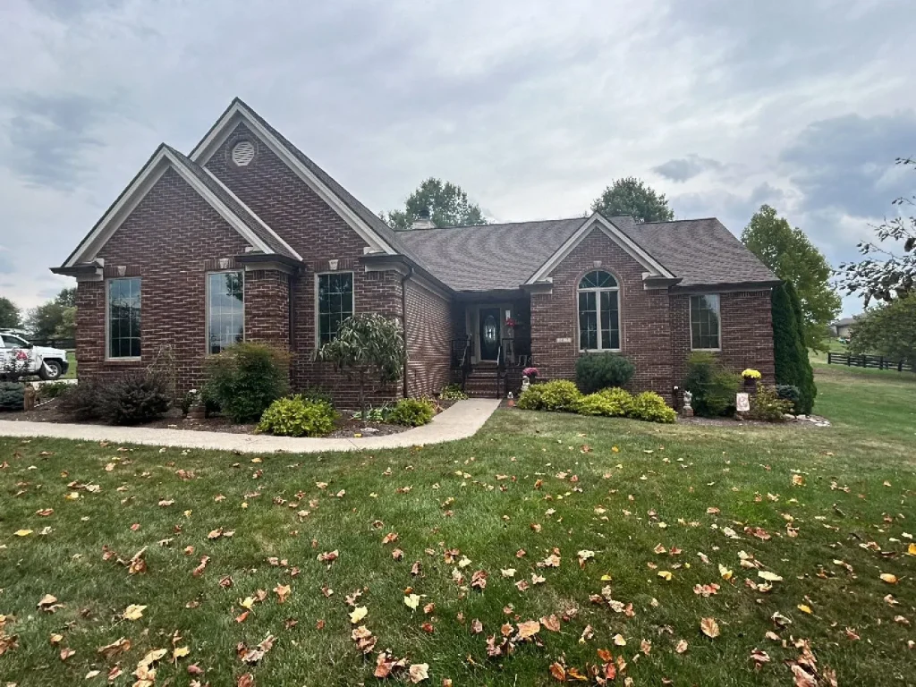 Richmond home with a new roof replacement by AIC Roofing & Construction.