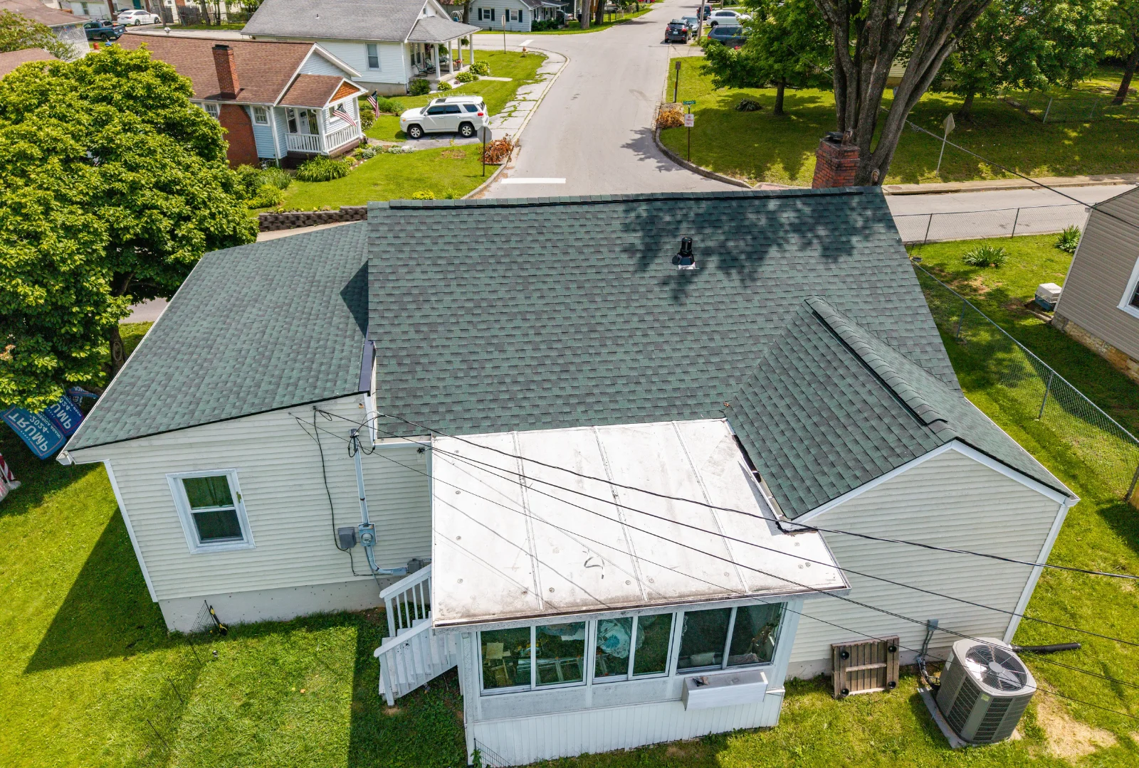 Aerial view of a Frankfort KY home with newly installed Hunter Green GAF shingles after a full roof replacement