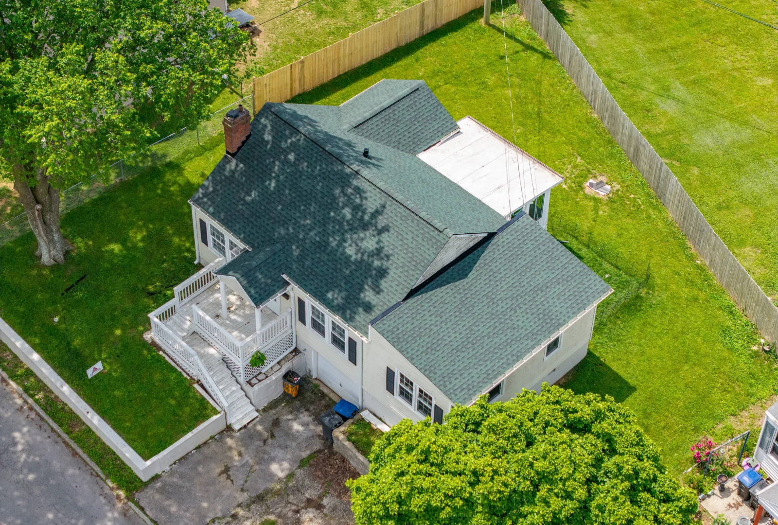 Aerial view of a house in Frankfort KY with a new roof replacement using GAF Hunter Green shingles