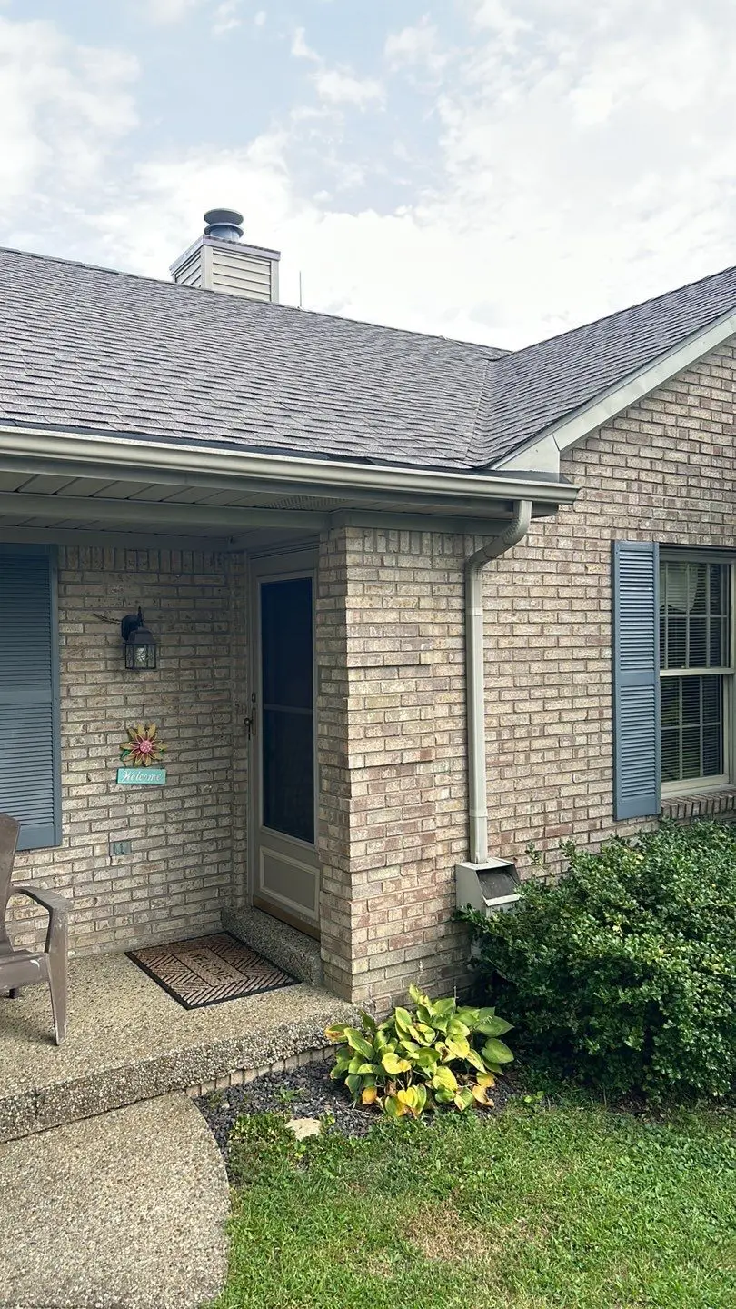 Close-up view of a new gutter installation on a brick home in Mount Eden, KY, completed by AIC Roofing.