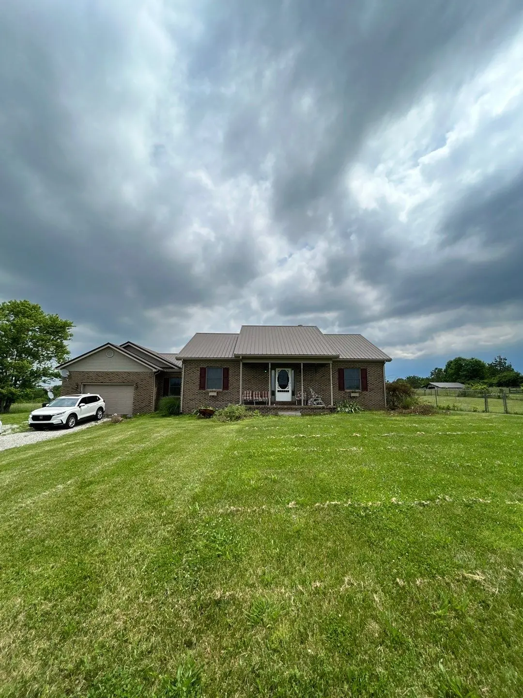 Roof replacement on a brick home in Salvisa, KY completed by AIC Roofing & Construction.