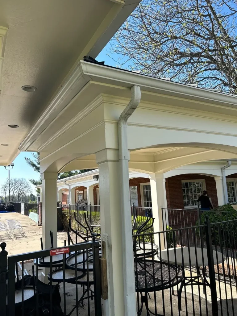 New white gutter system installed on a Lexington, KY home by AIC Roofing & Construction.