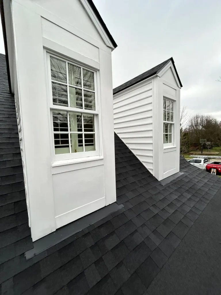 New white siding installation on dormers of a Lexington, KY home by AIC Roofing & Construction.