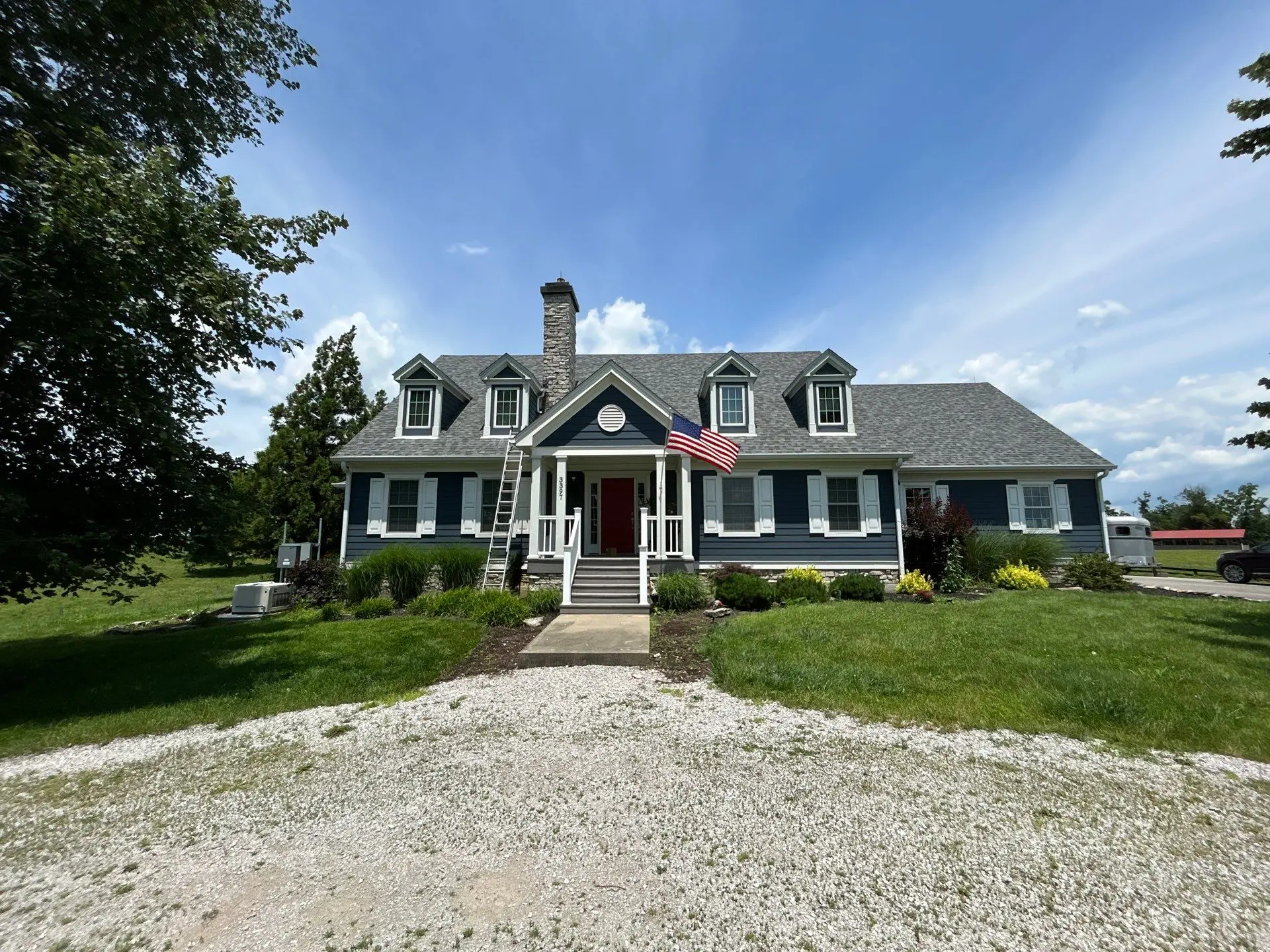 New roof installation on a home in Carlisle, KY, completed by AIC Roofing & Construction, with dark asphalt shingles and clean architectural lines.