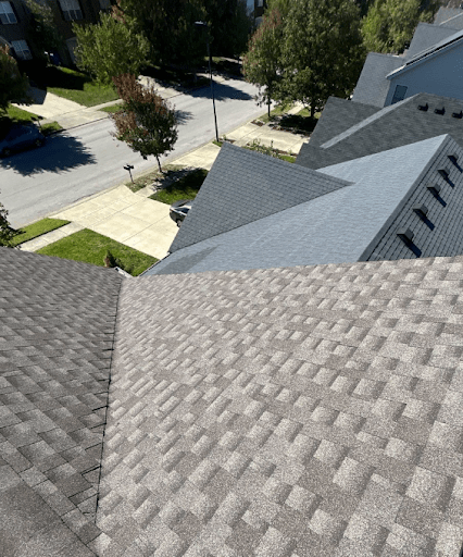 Side-by-side comparison of two different shingle types on Lexington, KY rooftops, installed by AIC Roofing.