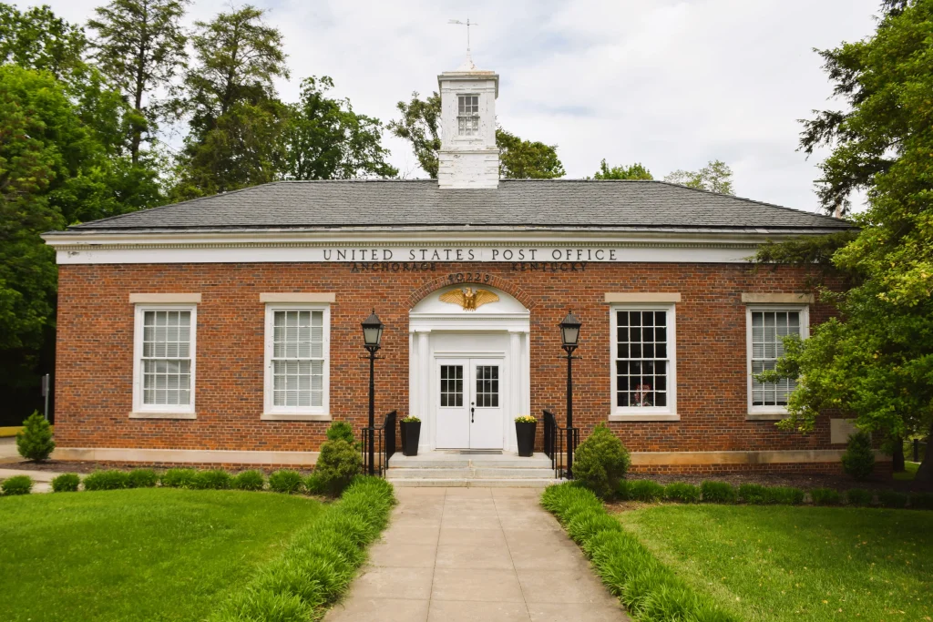 Front view of the historic Anchorage, Kentucky post office with classic brickwork and shingle roof