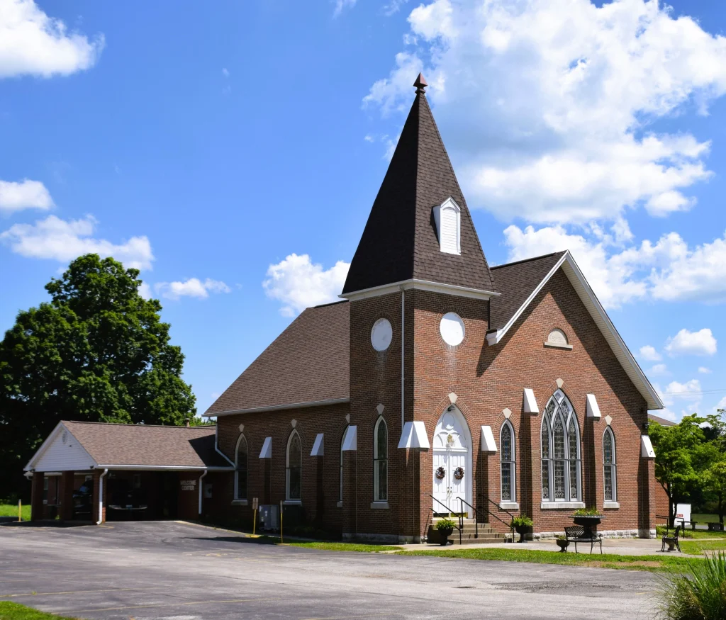 A traditional church with a steep roof in Bagdad, Kentucky, ideal for Bagdad roofing projects.