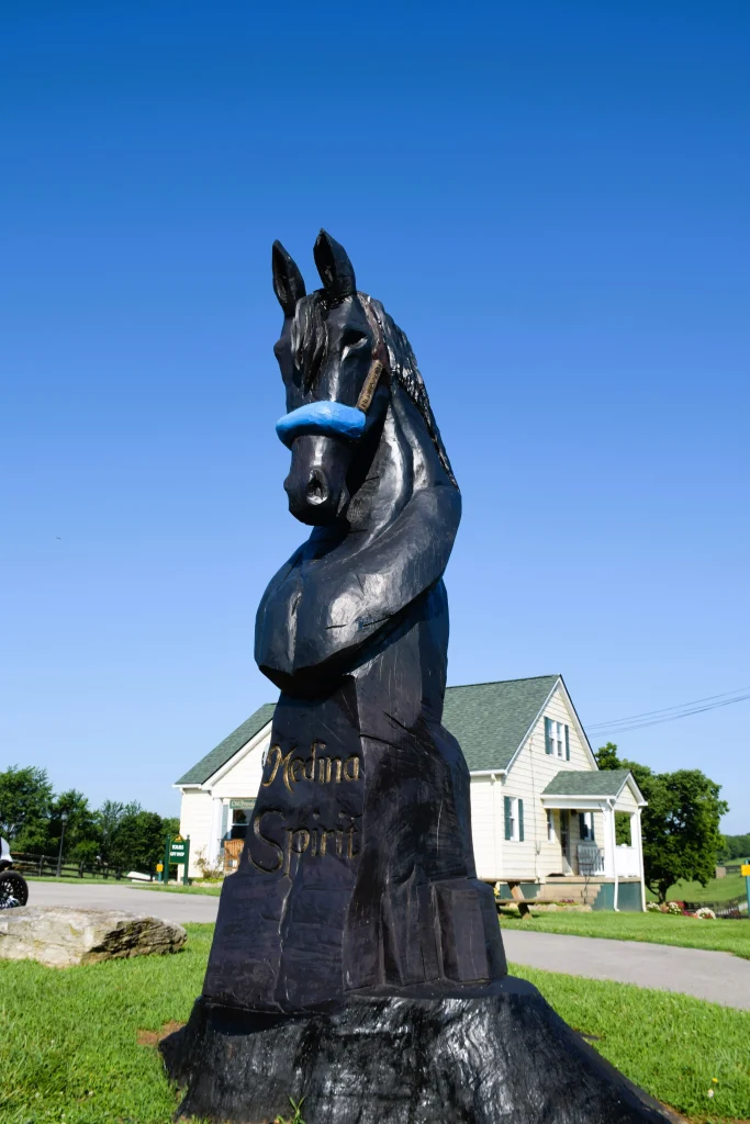 Wooden sculpture of Medina Spirit horse in Georgetown, KY.