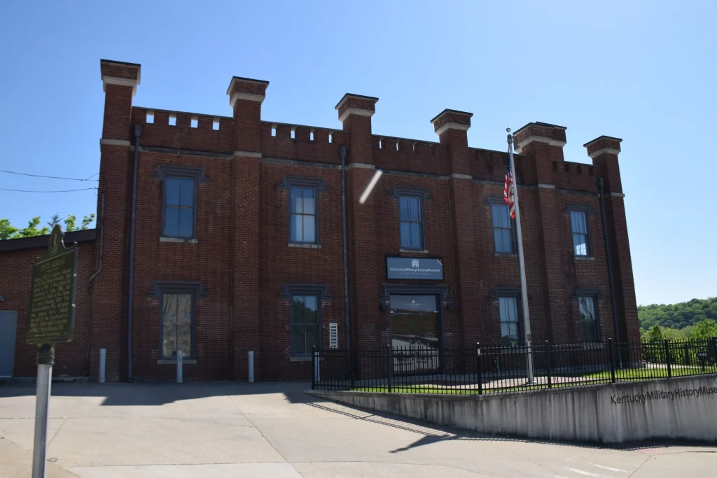 Front view of the Kentucky Military History Museum in Frankfort, KY, showing its historic brick structure under clear blue skies