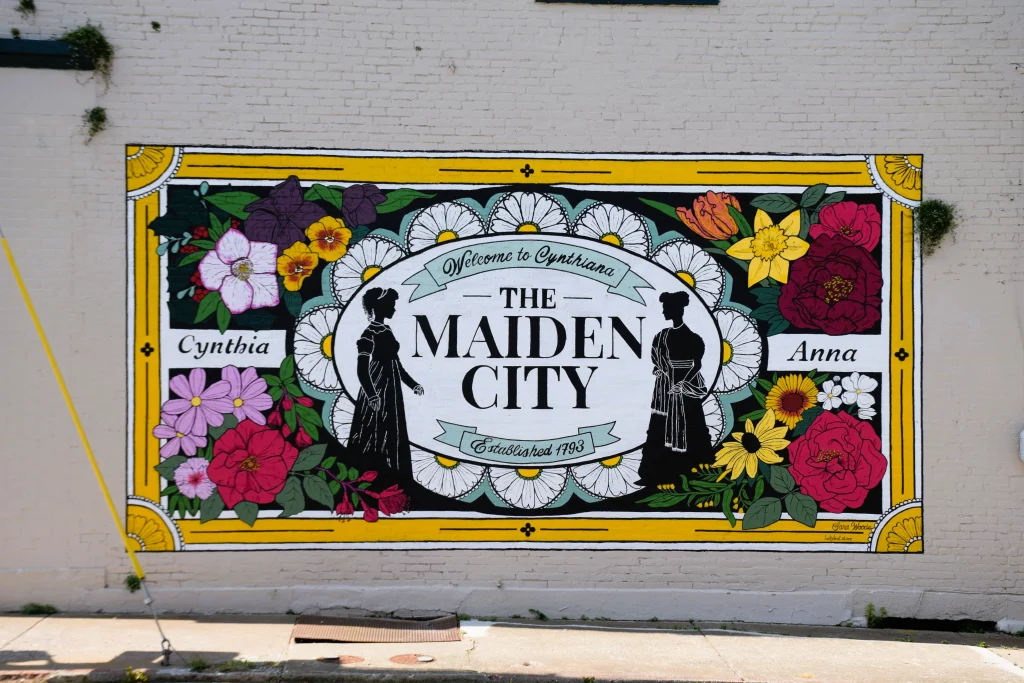 Maiden City mural in Cynthiana Kentucky featuring flowers and local history
