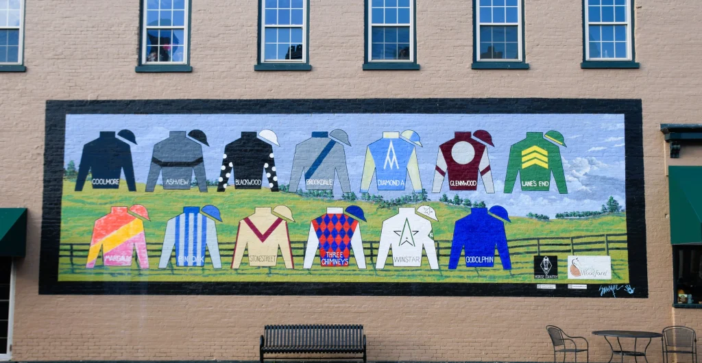 Colorful mural of jockey silks representing major horse farms in Versailles, Kentucky