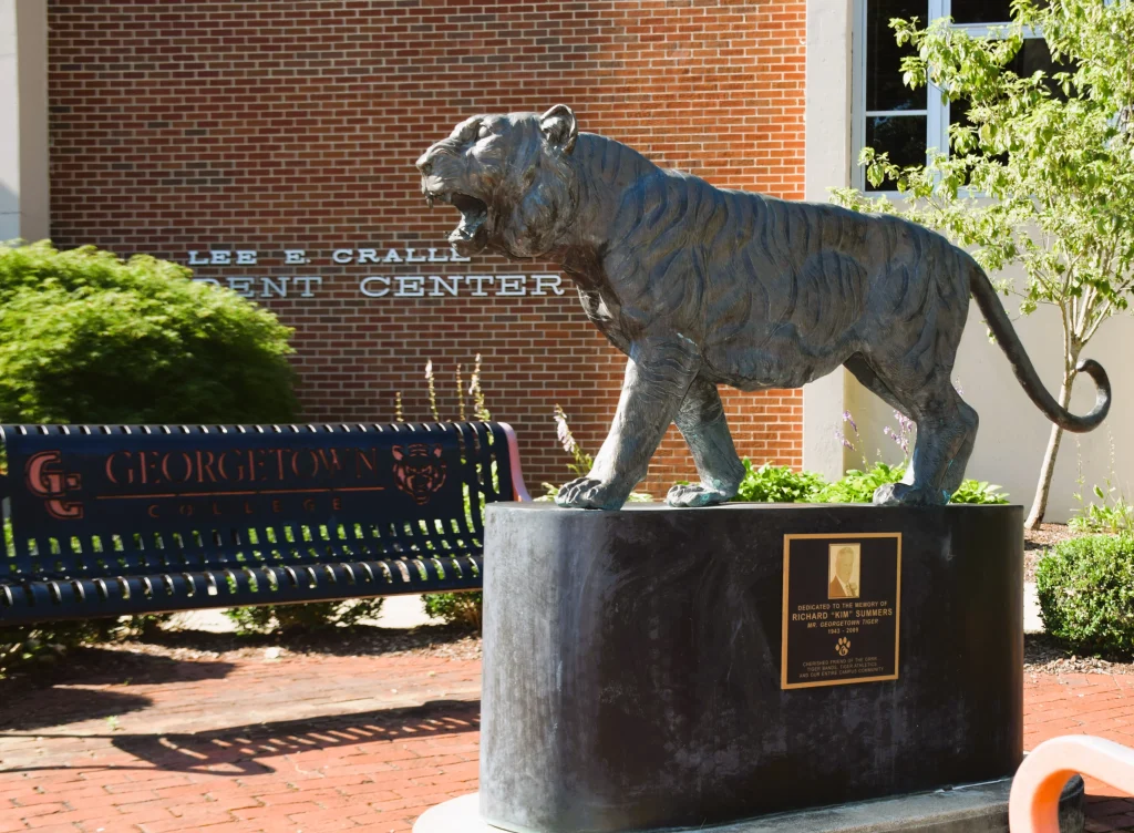 Bronze tiger statue in front of the student center at Georgetown College.
