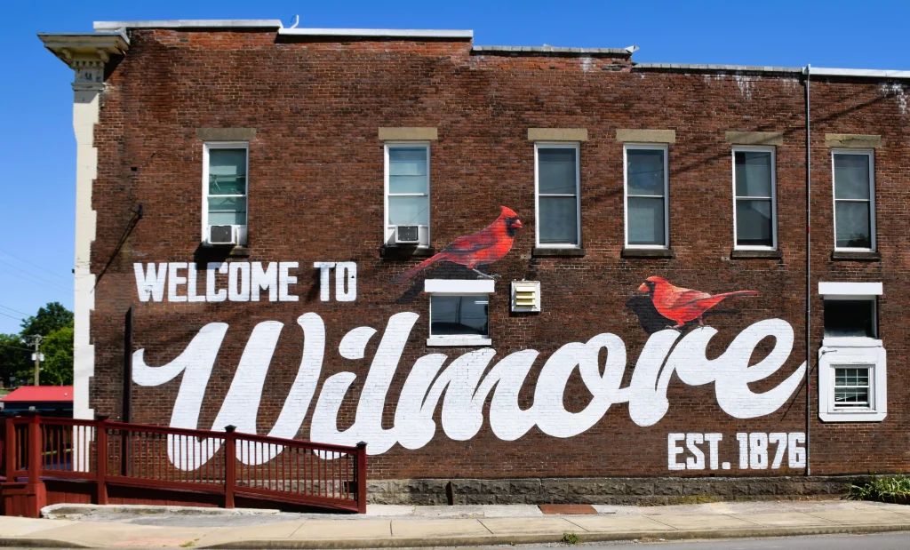 Welcome to Wilmore mural with cardinals, featuring a historic downtown building ideal for Wilmore roofing projects