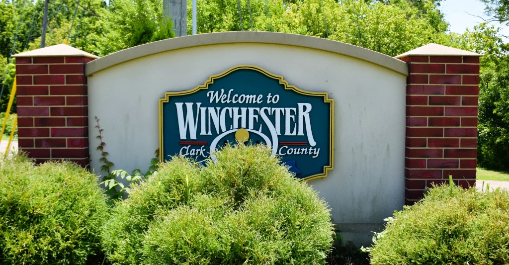 Welcome to Winchester Kentucky sign with landscaping in front