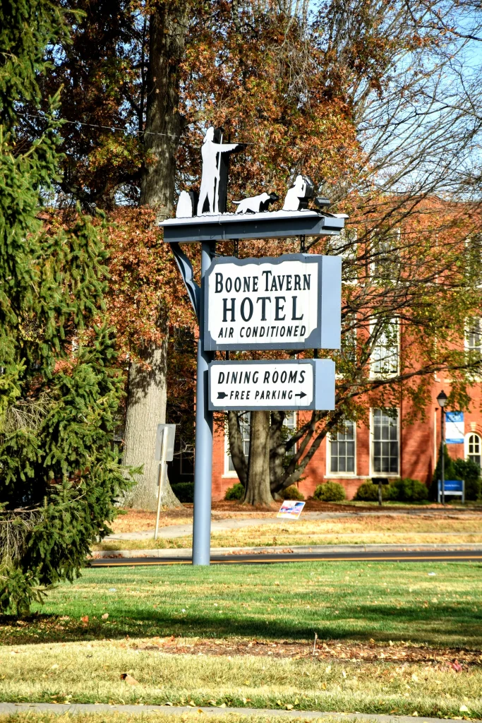 Boone Tavern Hotel roadside sign surrounded by trees in Berea, Kentucky
